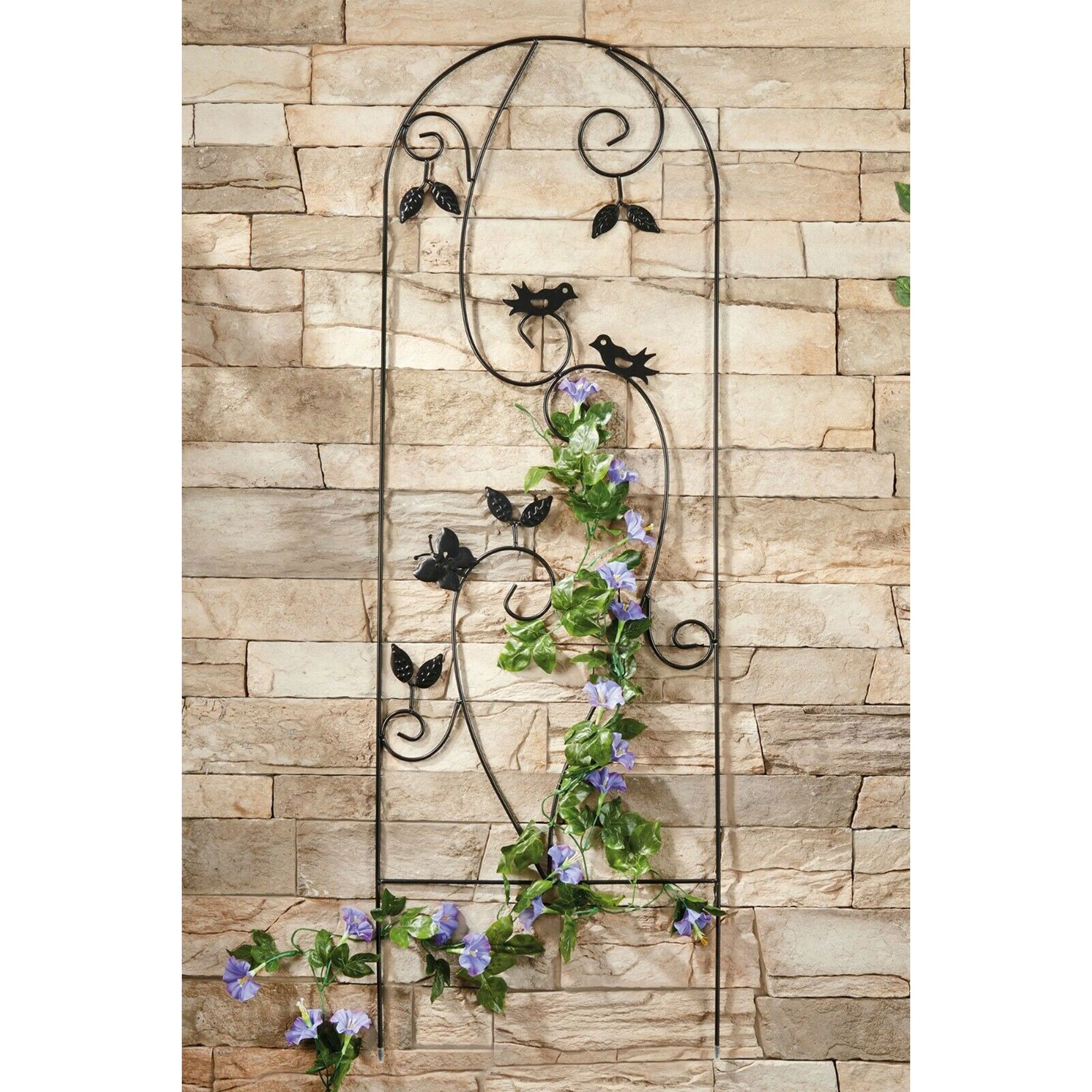 Black metal plant support featuring intricate bird and leaf designs, measuring 1.2m, ideal for climbing plants against a stone wall backdrop.