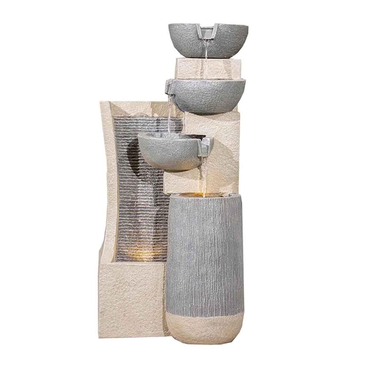 Serenity Cascading Four Bowl water feature in grey and beige stone-like material, featuring LED light and flowing water from bowls into a textured wall.
