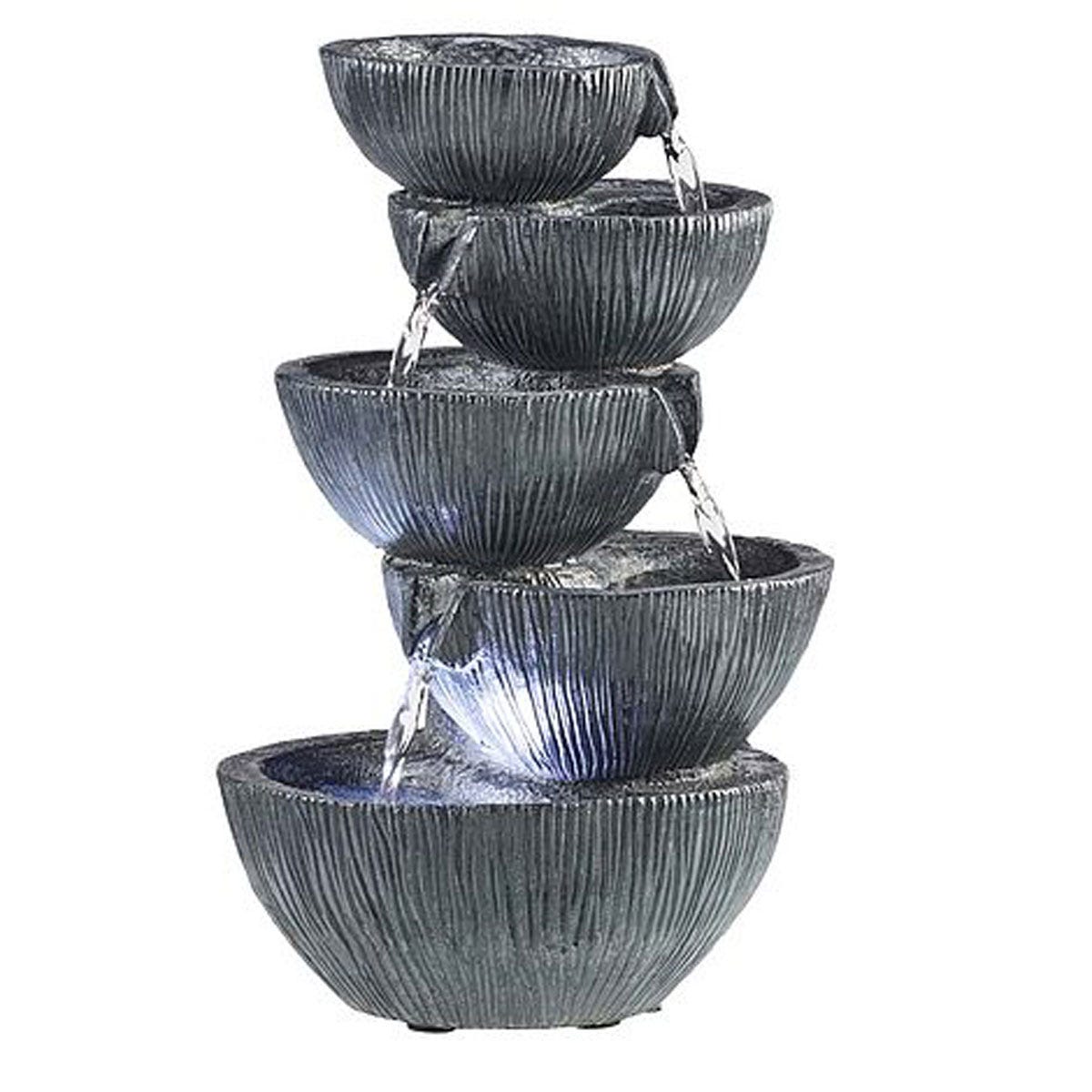 Five cascading bowls in a textured dark gray finish, made from durable material, with water flowing gently between them, illuminated by a soft light at the base.