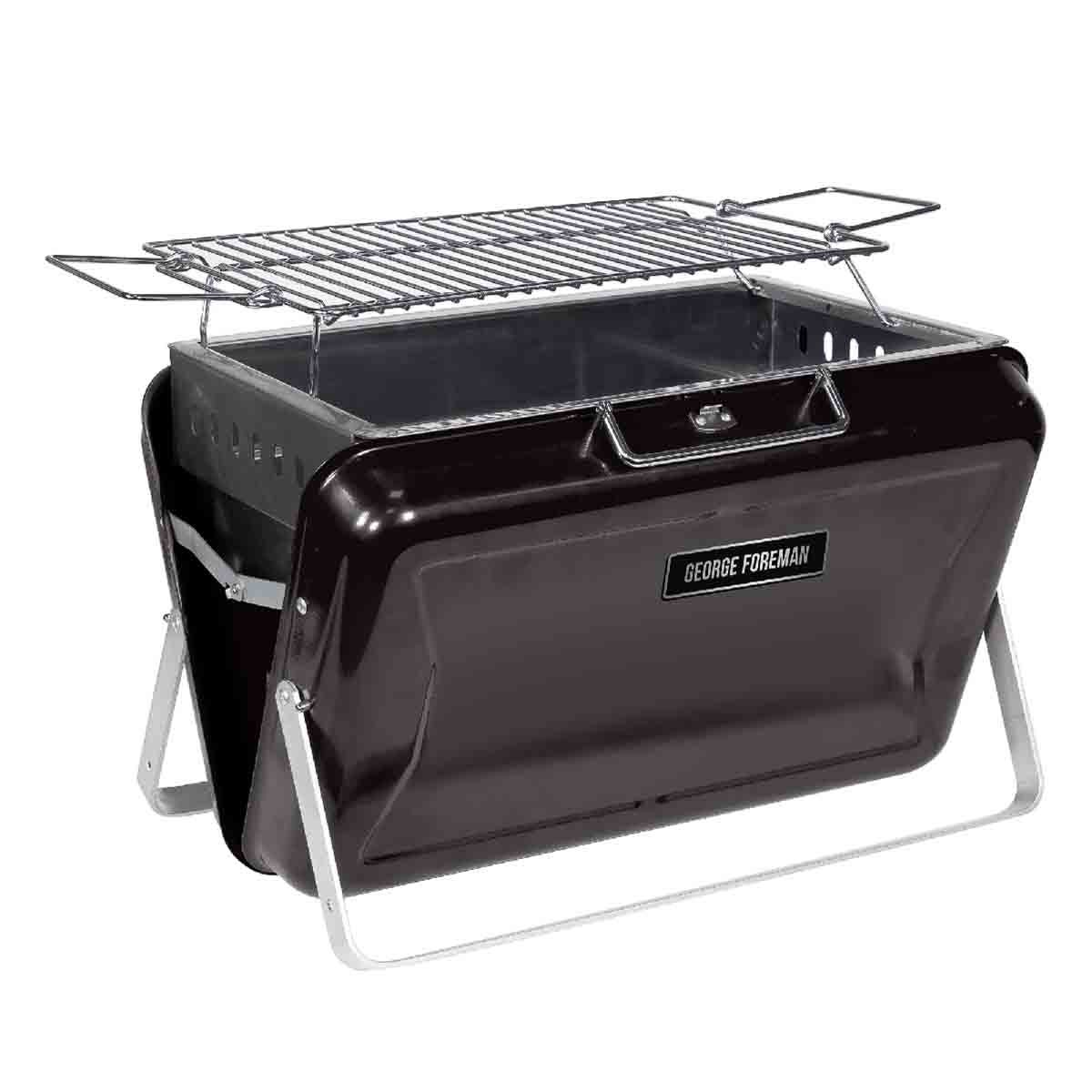 Black portable charcoal BBQ with foldable legs, convenient handle, and a stainless steel grilling grate, featuring a sleek design and compact storage capability.