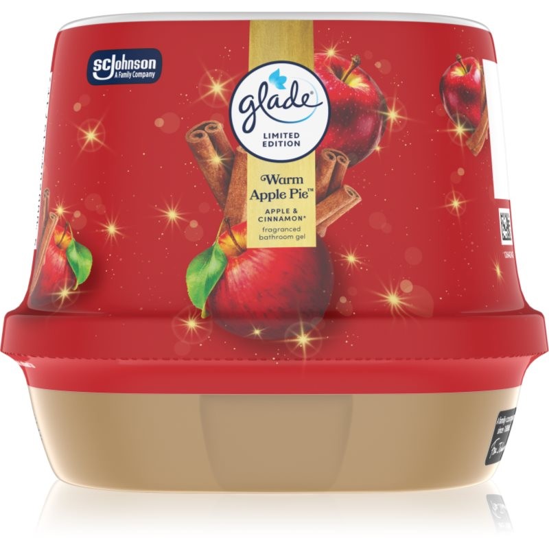 Red and gold container of GLADE Warm Apple Pie air freshener, featuring apple and cinnamon graphics, with a textured lid and a beige base, labeled as a limited edition product.