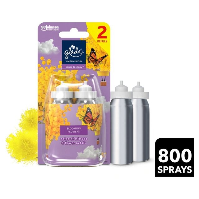 Two silver spray refills in a clear packaging, featuring a vibrant yellow floral design with a butterfly, labeled "Glade Sense & Spray, Blooming Flowers, 2 X 18ml".