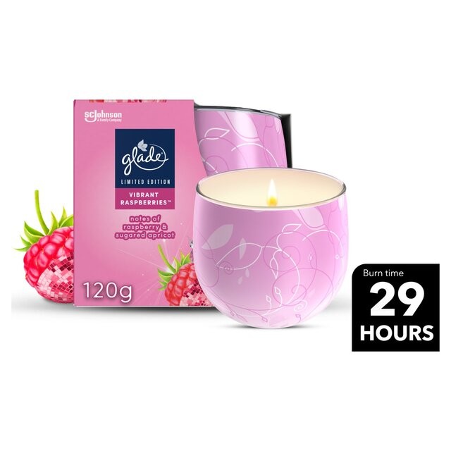 Glade Vibrant Raspberries scented candle in a round, pink glass container with floral designs, packaged in a matching pink box, featuring a burn time of 29 hours.