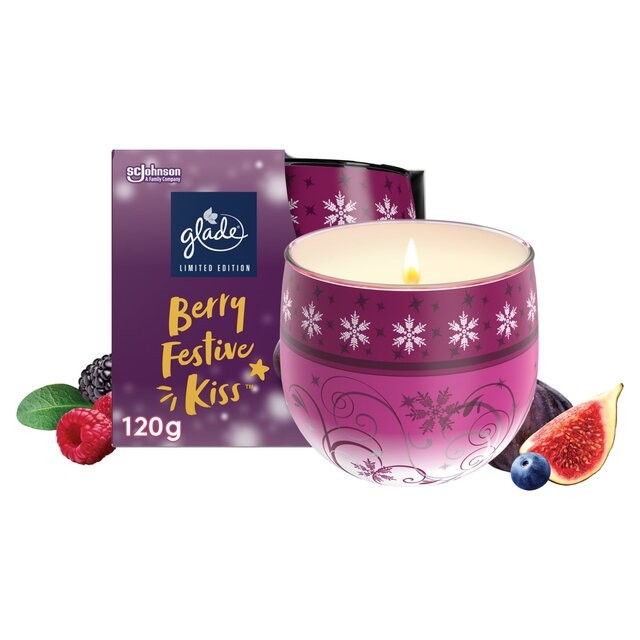 Glade Berry Festive Kiss scented candle in a decorative purple glass holder with snowflake designs, accompanied by a vibrant box, featuring berries and figs.
