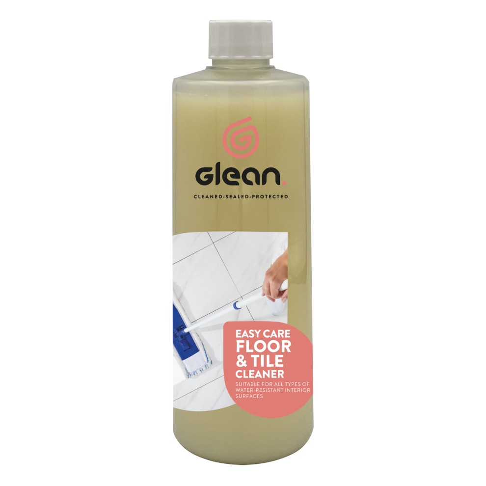 Clear plastic bottle containing 500ml of Glean Easy Care Floor & Tile Cleaner, featuring a light yellow liquid and a pink label with white text and logo.
