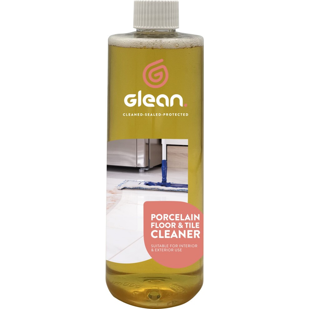 Clear plastic bottle with a yellow liquid cleaner, labeled "Glean Porcelain Floor & Tile Cleaner," featuring a pink circular logo and text indicating suitability for interior and exterior use.