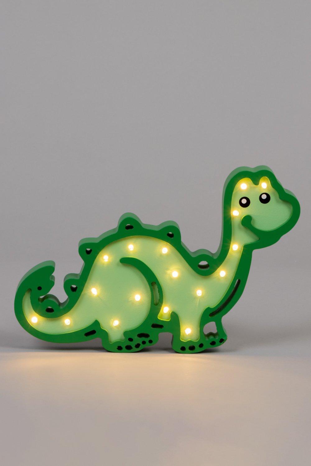 Green wooden dinosaur table light with glowing LED features, rounded body, and friendly expression, perfect for children's rooms.