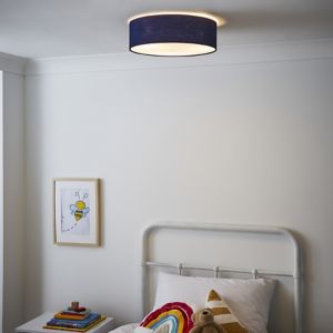 Navy blue flush ceiling light with a soft glow, featuring a cylindrical fabric shade, illuminating a cozy children's bedroom with a bed and colorful decor.