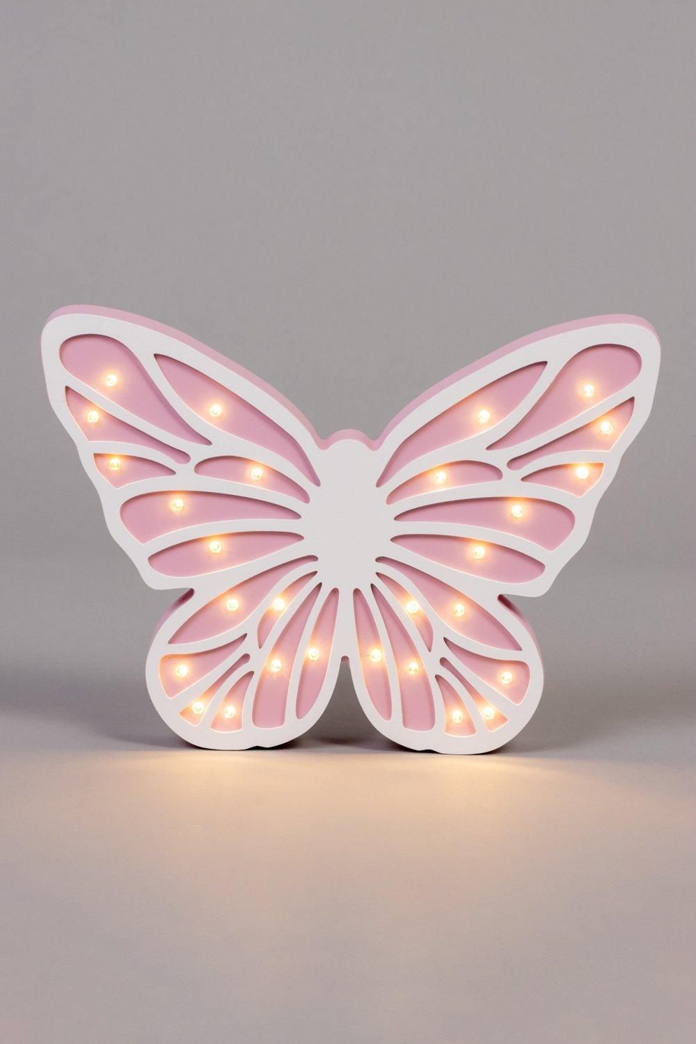 Pink butterfly-shaped table lamp with cut-out details and warm LED lights, featuring a glossy finish and a white base for a whimsical decor accent.