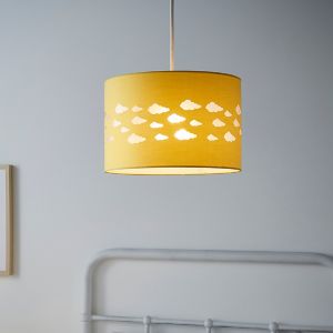Yellow cylindrical light shade featuring cut-out cloud designs, measuring 30cm in diameter and 21cm high, suspended from a ceiling in a softly lit room.