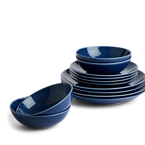 Navy blue 12-piece dinner set by Royal Doulton, featuring ribbed detailing with dinner plates, bowls, and serving dishes made from durable ceramic material.