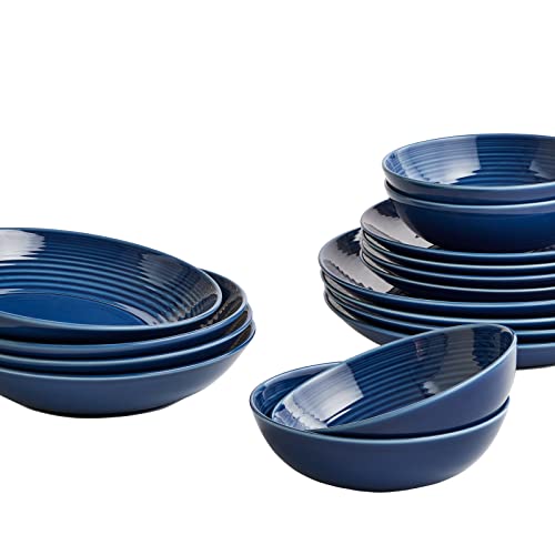 Royal Doulton's Gordon Ramsay Maze Denim 16-piece dinnerware set features a rich navy blue color with ribbed detailing, including various bowls and plates in different sizes.