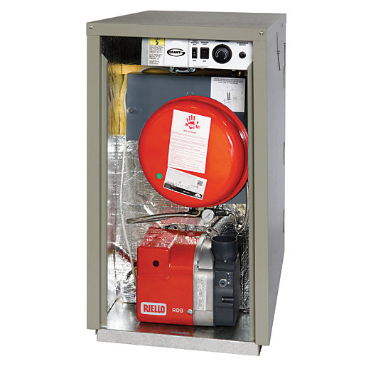 Grant Vortex Eco External Sealed System Module in a grey metal casing, featuring a red Riello burner and visible internal components, designed for efficient heating in a compact form.