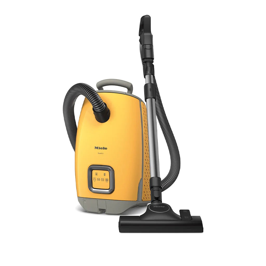 Miele Guard L1 Flex Vacuum Cleaner in vibrant sunset yellow, featuring a sleek design, flexible hose, and a compact body with easy-to-use controls.