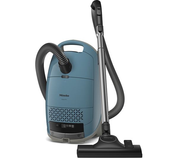 Miele Guard M1Flex Vacuum Cleaner in Nordic Blue features a sleek design with a textured front panel, flexible hose, and a metallic nozzle, showcasing modern aesthetics and functionality.