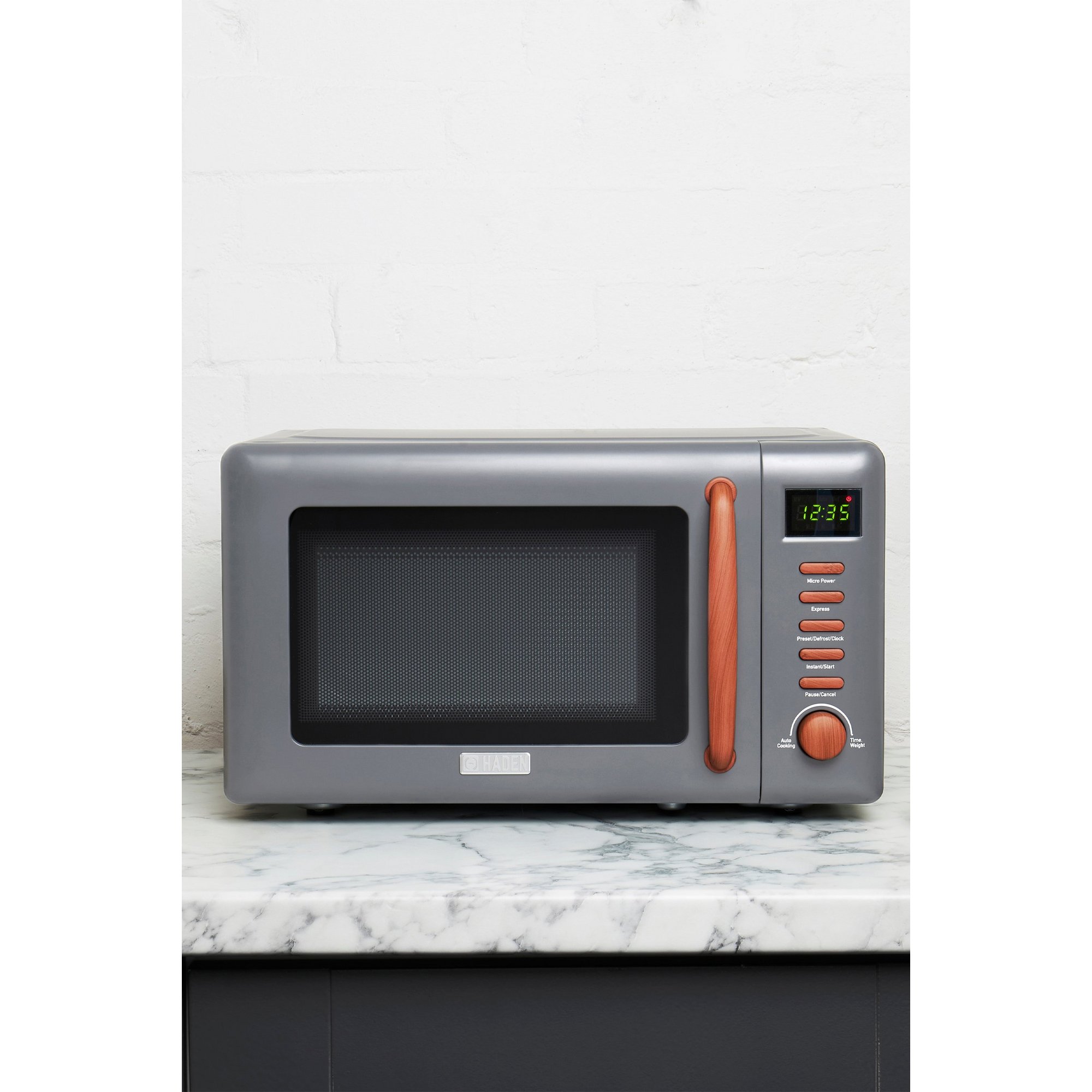 Green Haden Dorchester kettle, 4-slice toaster, and microwave set featuring a sleek design with metallic accents and easy-to-use controls, perfect for modern kitchens.