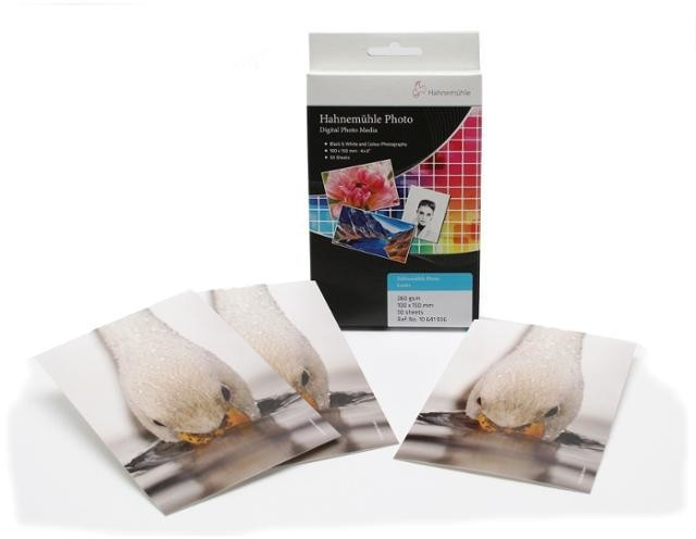 Hahnemuehle Photo Luster pack containing 50 glossy 10cm x 15cm photo papers, featuring vibrant colors and a smooth surface, ideal for high-quality photography prints.