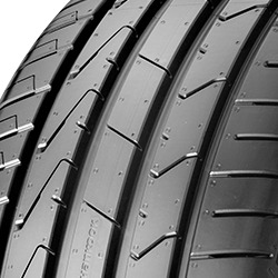Black summer tyre with a sleek tread pattern, featuring deep grooves for enhanced grip, labeled "Hankook Ventus Prime 3 K125" and sized 185/65 R15 92V.