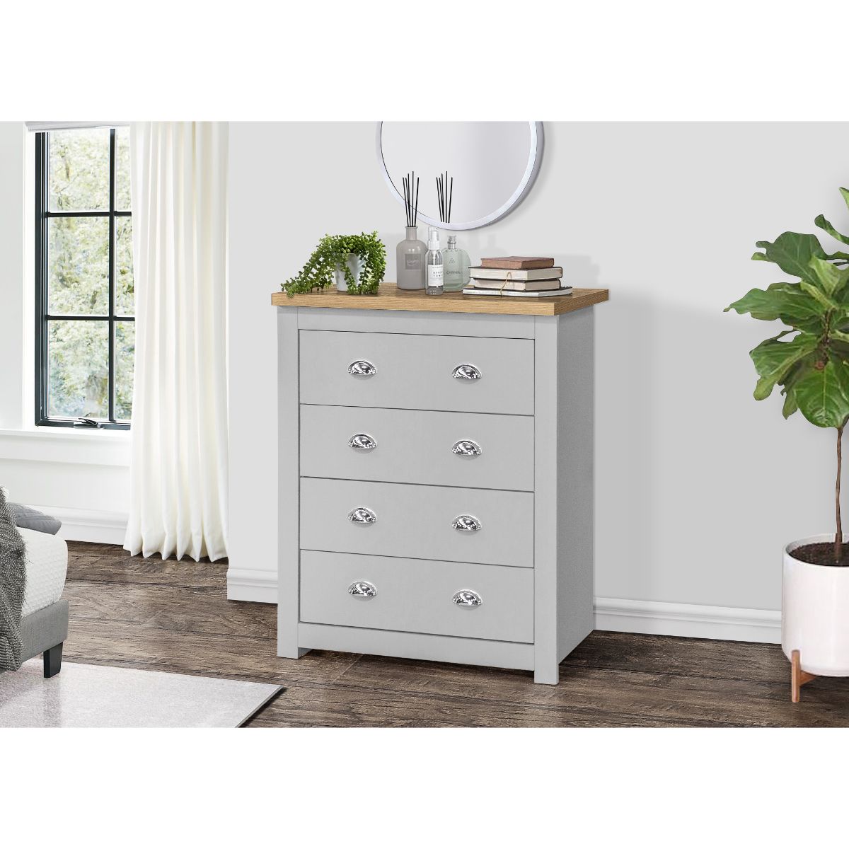 Birlea Highgate 4 Drawer Chest features a grey body with an oak top, four spacious drawers with silver handles, and a modern design, set against a light room backdrop.