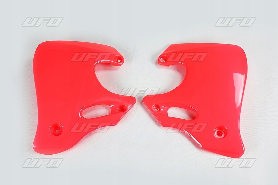 Red UFO radiator scoops designed for Honda CR125 (1993-94) and CR250 (1992-94), featuring a glossy finish and cutouts for mounting.