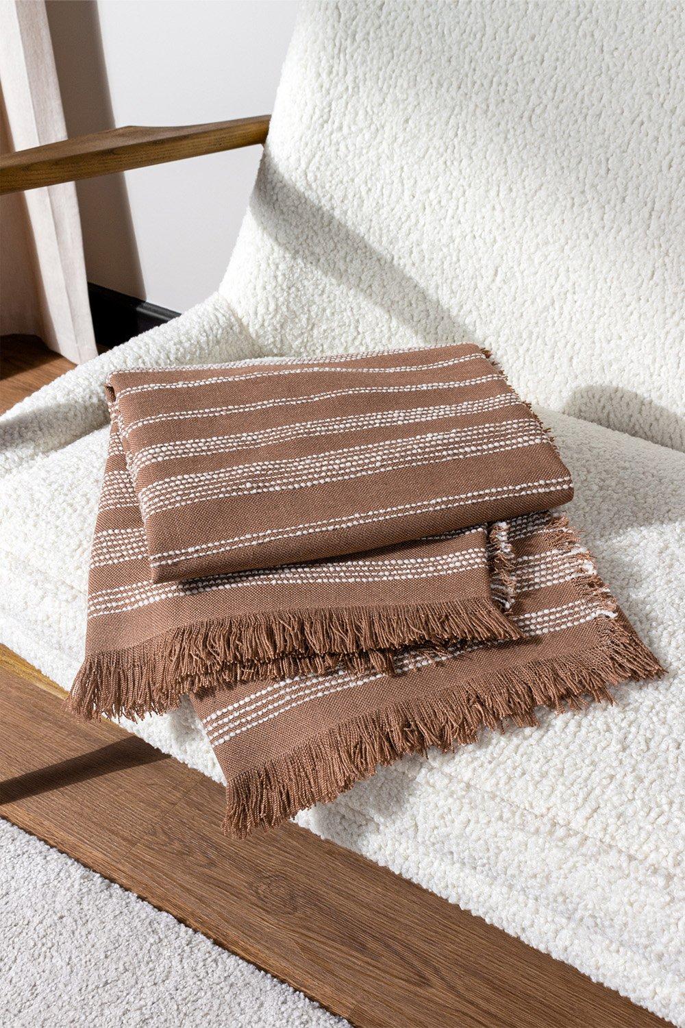 Soft pink woven throw blanket featuring a boucle texture and fringed edges, with a striped pattern in contrasting colors, perfect for cozying up.