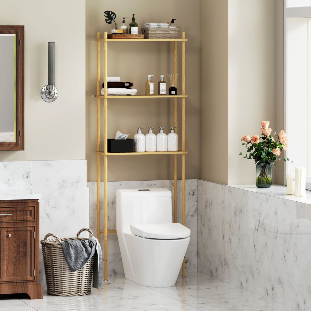 Bamboo over toilet storage unit with three slatted shelves, natural finish, positioned beside a white toilet in a stylish bathroom setting with marble accents.