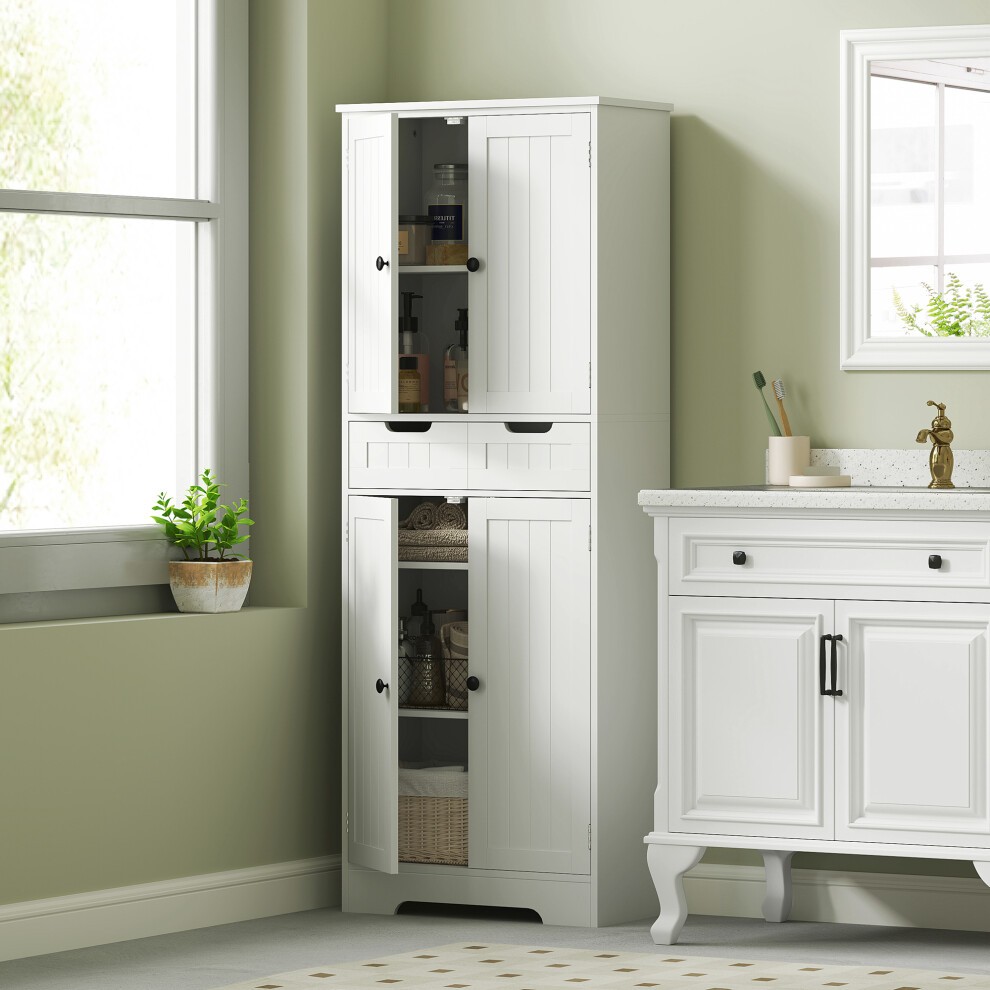 Tall white bathroom cabinet with two doors, a drawer, and adjustable shelves, featuring a slatted design and black knobs, set against a light green wall.