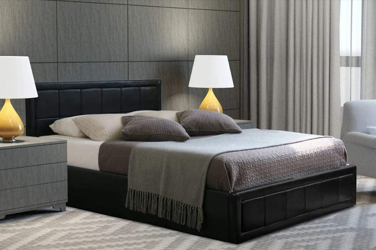 Black leather ottoman bed frame with storage, featuring a padded headboard, neatly made with a gray blanket and pillows, accompanied by two bedside lamps and a modern decor setting.