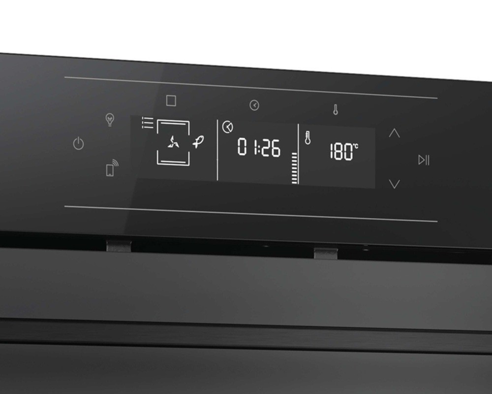 Sleek black oven with a touch control panel, featuring a digital timer, temperature display, and icons for various cooking functions, showcasing a modern design.