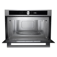 Stainless steel built-in microwave with a sleek black control panel, digital display, and a round glass turntable inside.