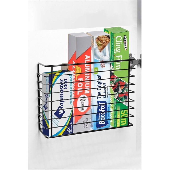 Wall-mounted kitchen storage basket in chrome plate with a sleek black finish, designed to hold various kitchen items like aluminum foil and cling film.