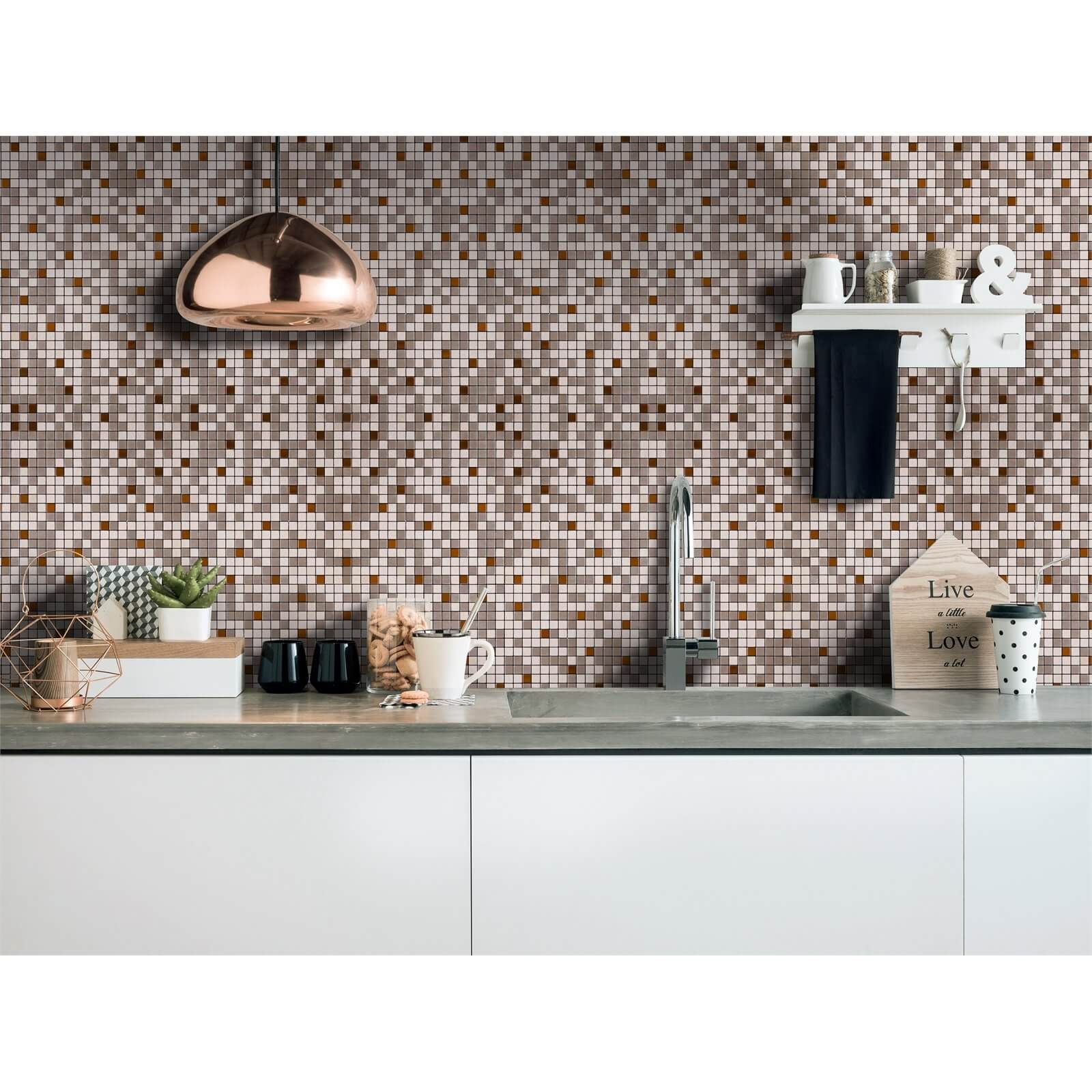 Self-adhesive bronze mosaic tile featuring a mix of brown, gold, and cream squares, ideal for kitchen backsplashes, set against a modern kitchen backdrop.
