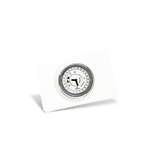 White rectangular mechanical timer with a circular dial featuring black hour markings and a central arrow, designed for 24-hour programming.