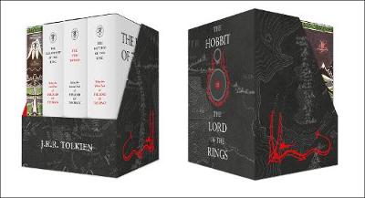 A black and red box set featuring three hardcover books: "The Hobbit" and "The Lord of the Rings," adorned with intricate designs and Tolkien's name on the front.