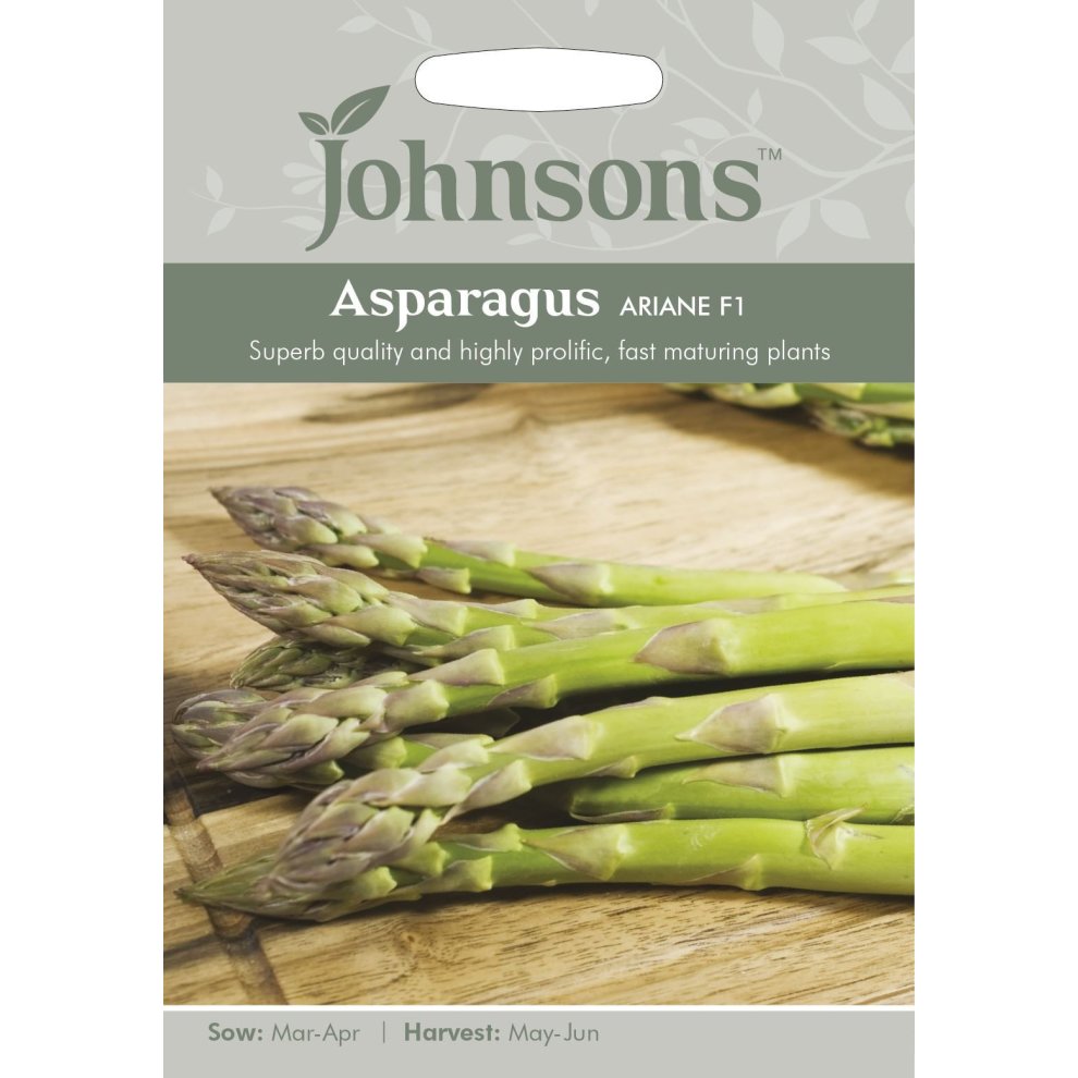 Green asparagus spears are prominently displayed on a light grey and green seed packet labeled "Johnsons Asparagus Ariane F1," highlighting sowing and harvesting details.