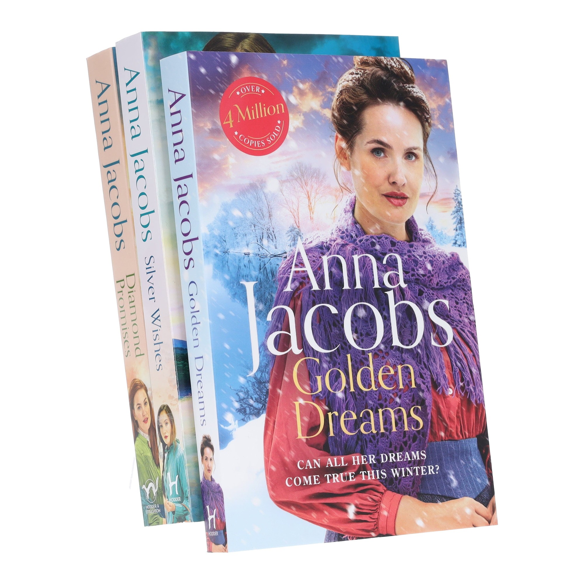 Three paperback books from the "Jubilee Lake Series" by Anna Jacobs, featuring colorful covers with a winter theme, showcasing titles: "Silver Wishes," "Golden Dreams," and "Diamond Promises."