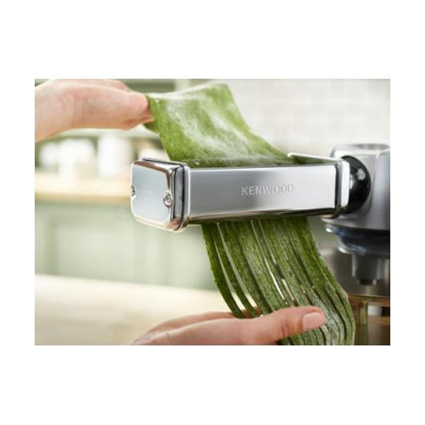 Kenwood Pasta Expert attachment in grey, made of stainless steel, showcasing green pasta being extruded, designed for lasagne, fettuccine, and spaghetti.