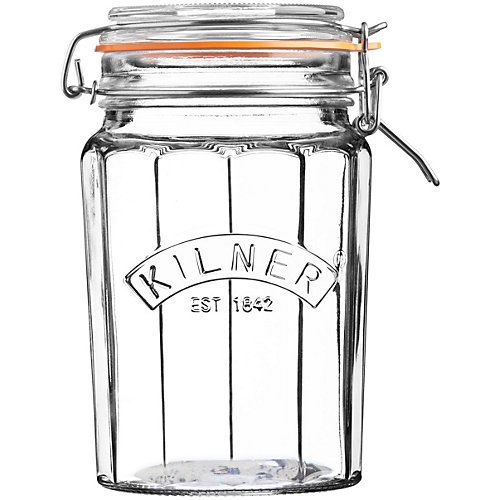 Transparent glass Kilner jar with a facetted design, 0.95L capacity, featuring an orange clip top lid and embossed logo, ideal for storage or preserving.