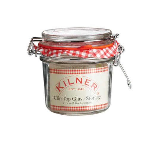 Clear glass storage jar with a clip-top lid, featuring a red and white gingham-patterned seal, labeled "Kilner" with established year 1842.
