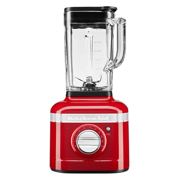 Bright red KitchenAid K400 Artisan blender with a glass pitcher, stainless steel blades, and a control dial on the front, showcasing a sleek and modern design.