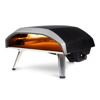 Black and silver Ooni Koda pizza oven with a curved top, orange interior glow, and sturdy legs, designed for outdoor use with a 16-inch cooking surface.