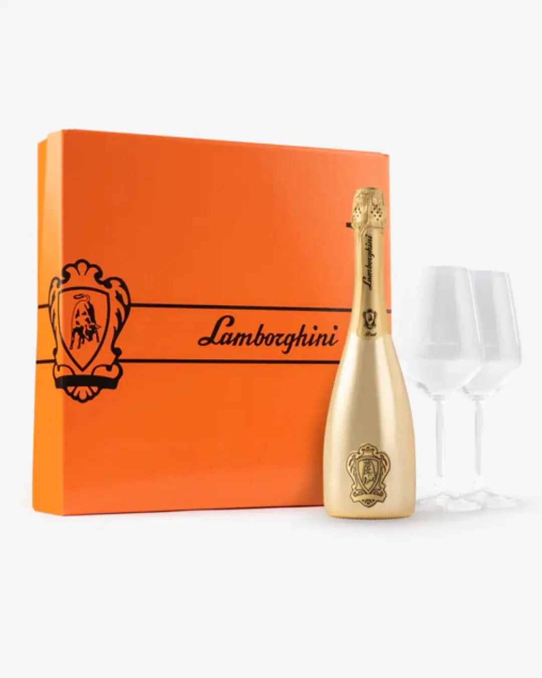 Gold bottle of Lamborghini Gold Brut sparkling wine in an orange gift box, accompanied by two crystal glasses, featuring the Lamborghini logo and elegant design.