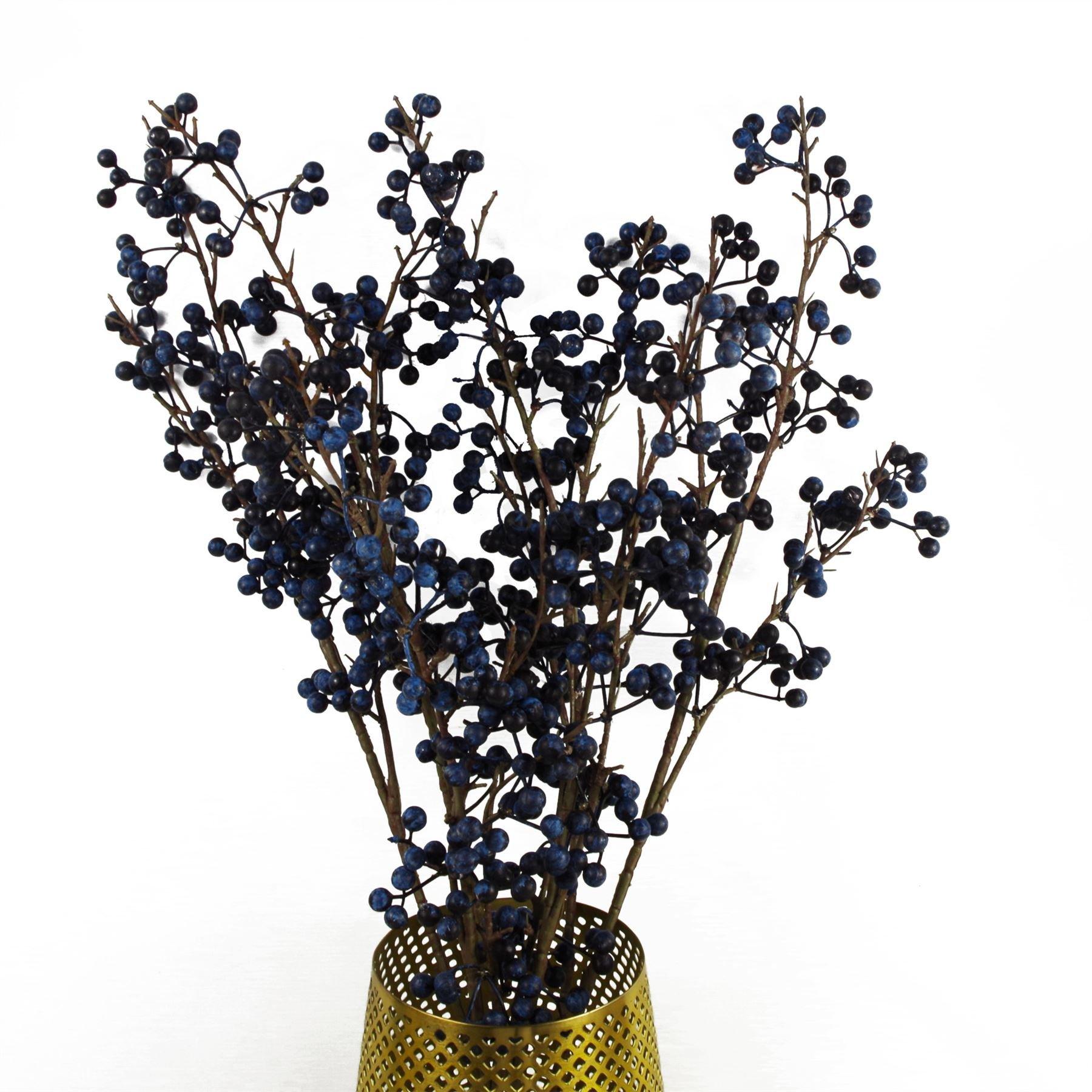 Artificial blue berry spray featuring clusters of dark blue berries on slender brown branches, arranged in a gold perforated vase, measuring 70 cm in height.
