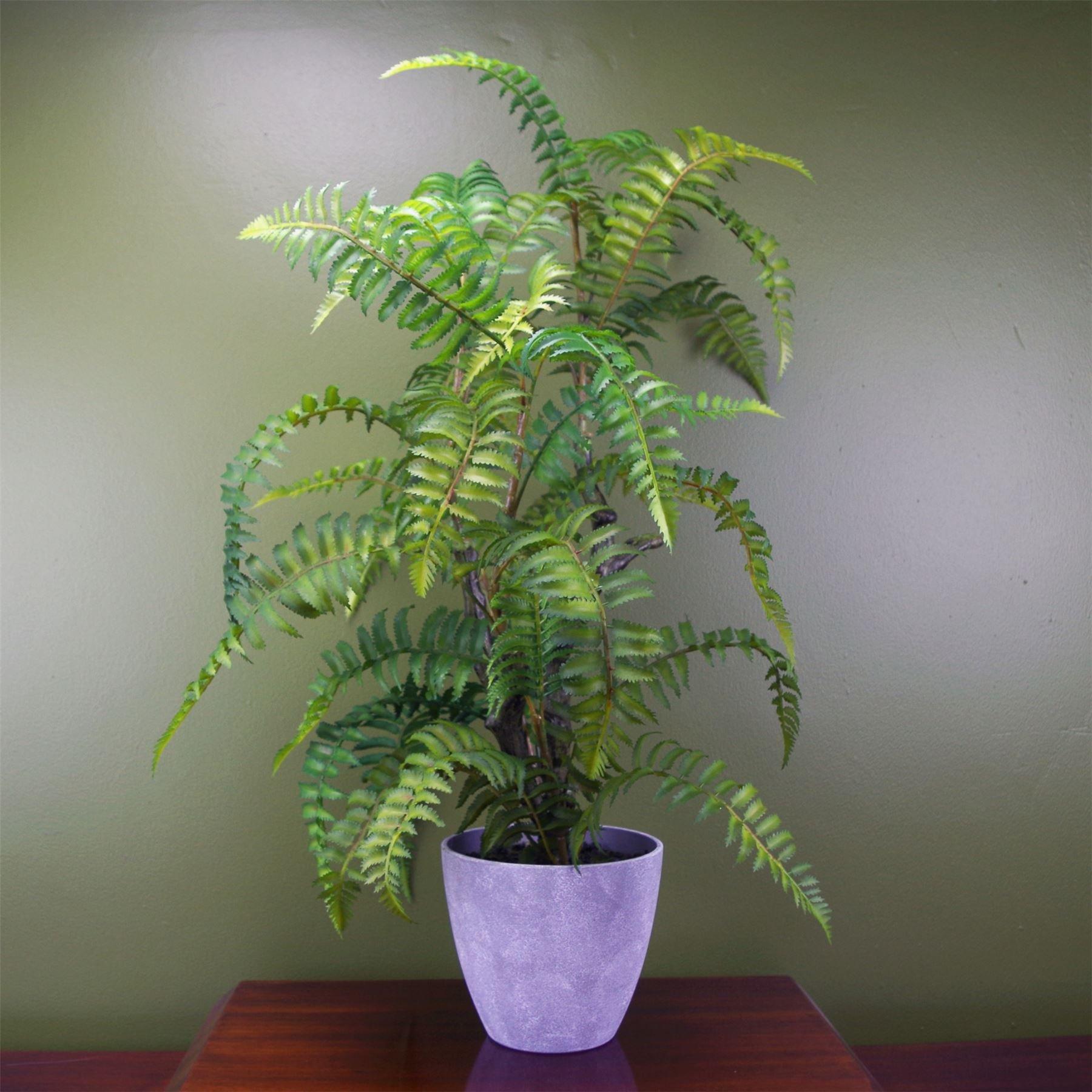 70cm tall artificial tree fern with vibrant green fronds, set in a textured grey decorative planter, against a muted green background.