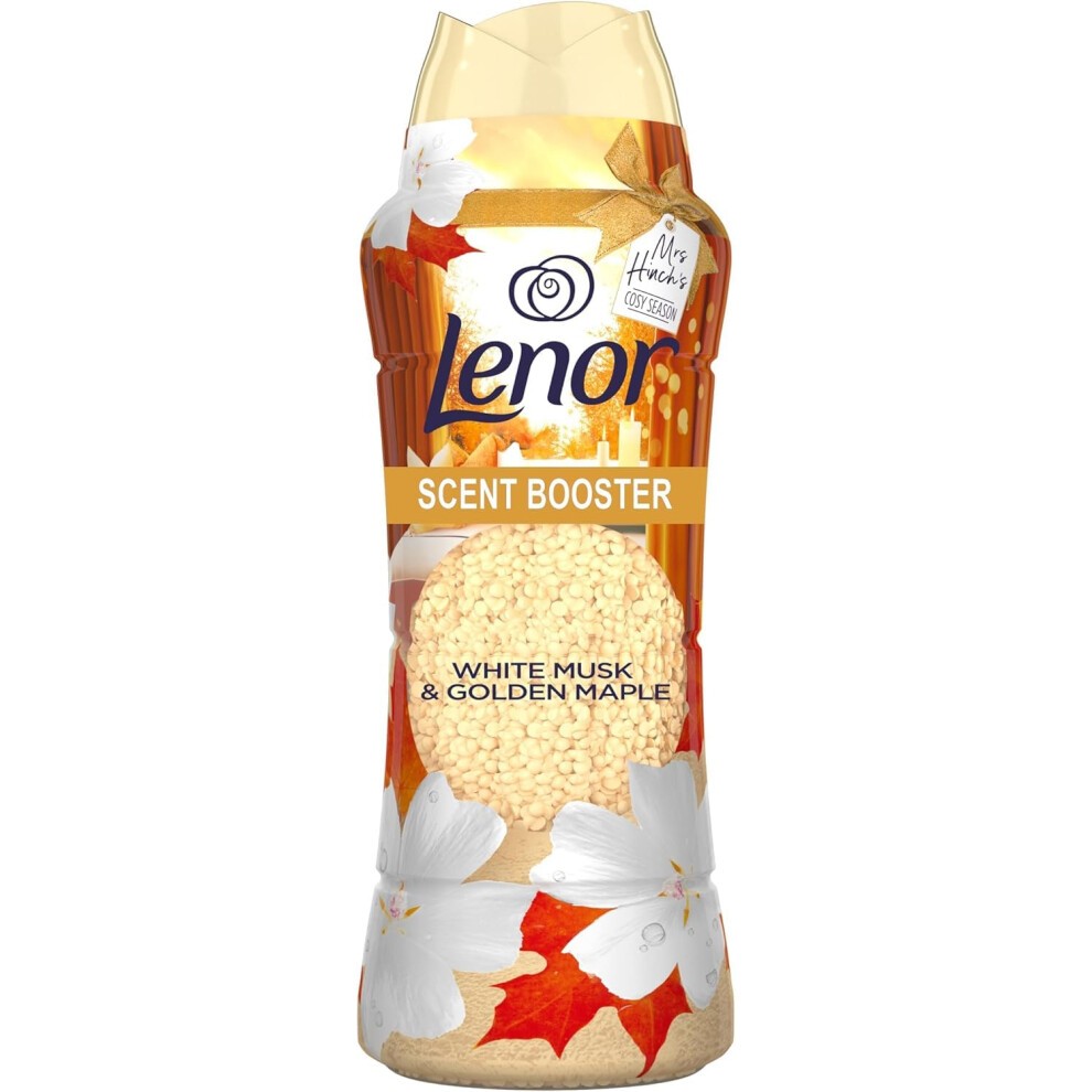 Transparent bottle of Lenor Scent Boosters, 570g, featuring a warm autumn design with white flowers and orange maple leaves, labeled "White Musk & Golden Maple."