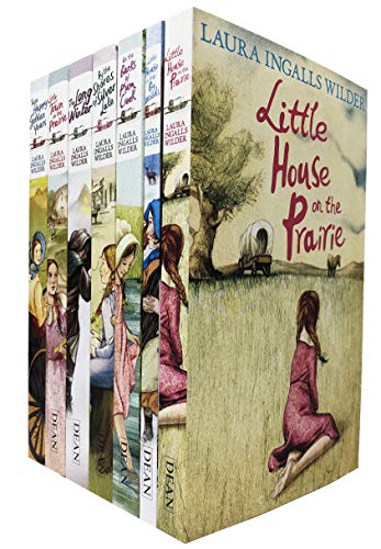 Seven paperback books from the "Little House on the Prairie" series by Laura Ingalls Wilder, featuring colorful covers with illustrations of prairie life and a girl in a dress.