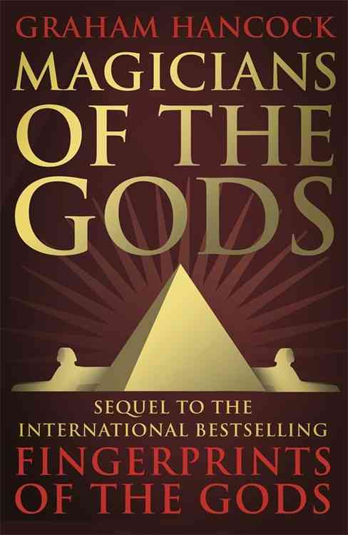 Dark red cover featuring a large golden pyramid at the center, flanked by two silhouettes, with the title "Magicians of the Gods" in bold gold lettering above.