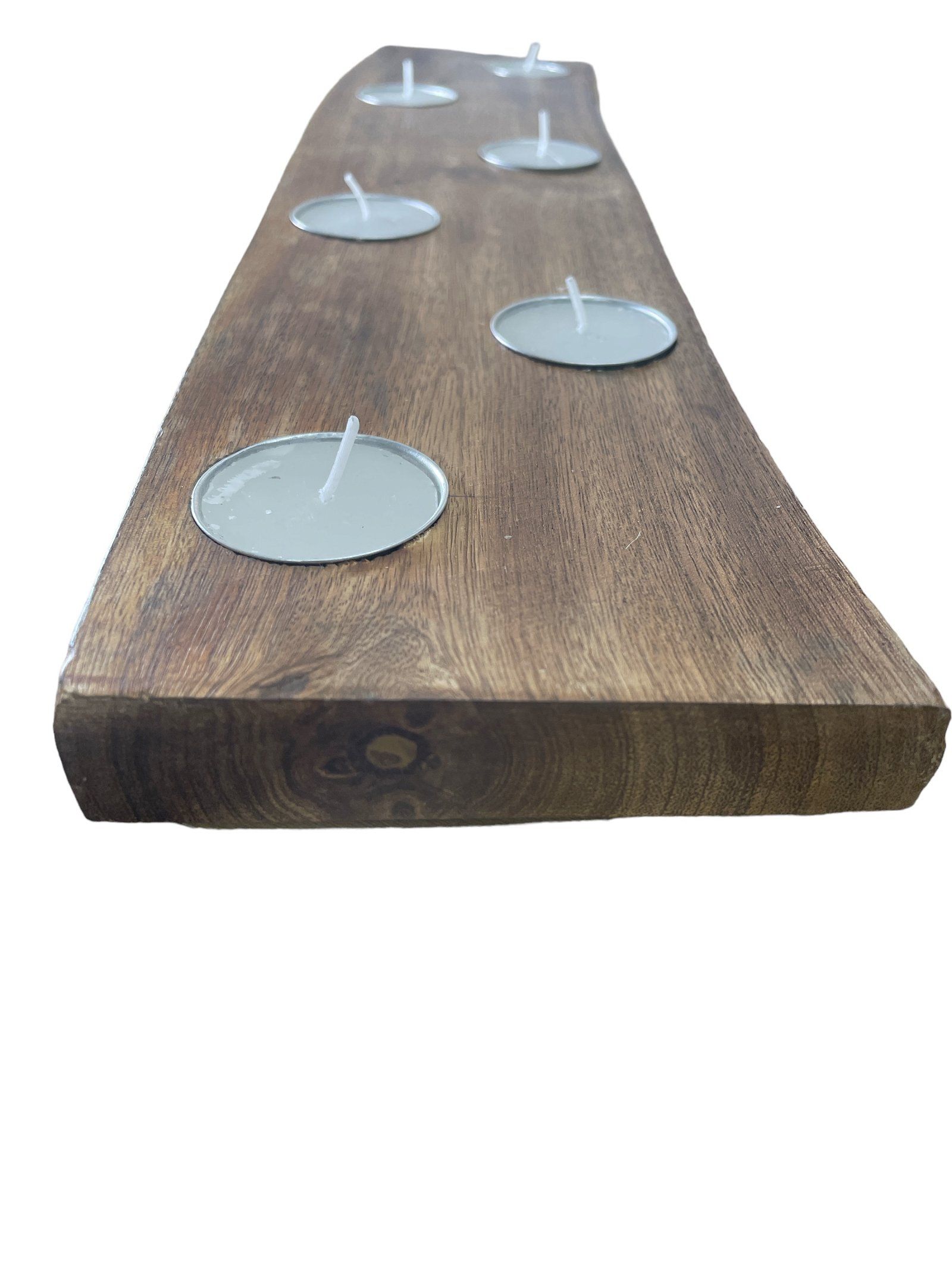 Short, curved mango wood tea light holder measuring 25cm, featuring six circular indentations for candles, showcasing a natural wood grain finish.