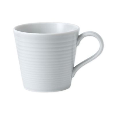 Ceramic mug in light gray with a textured ribbed design, featuring a comfortable handle and a modern, minimalist shape.