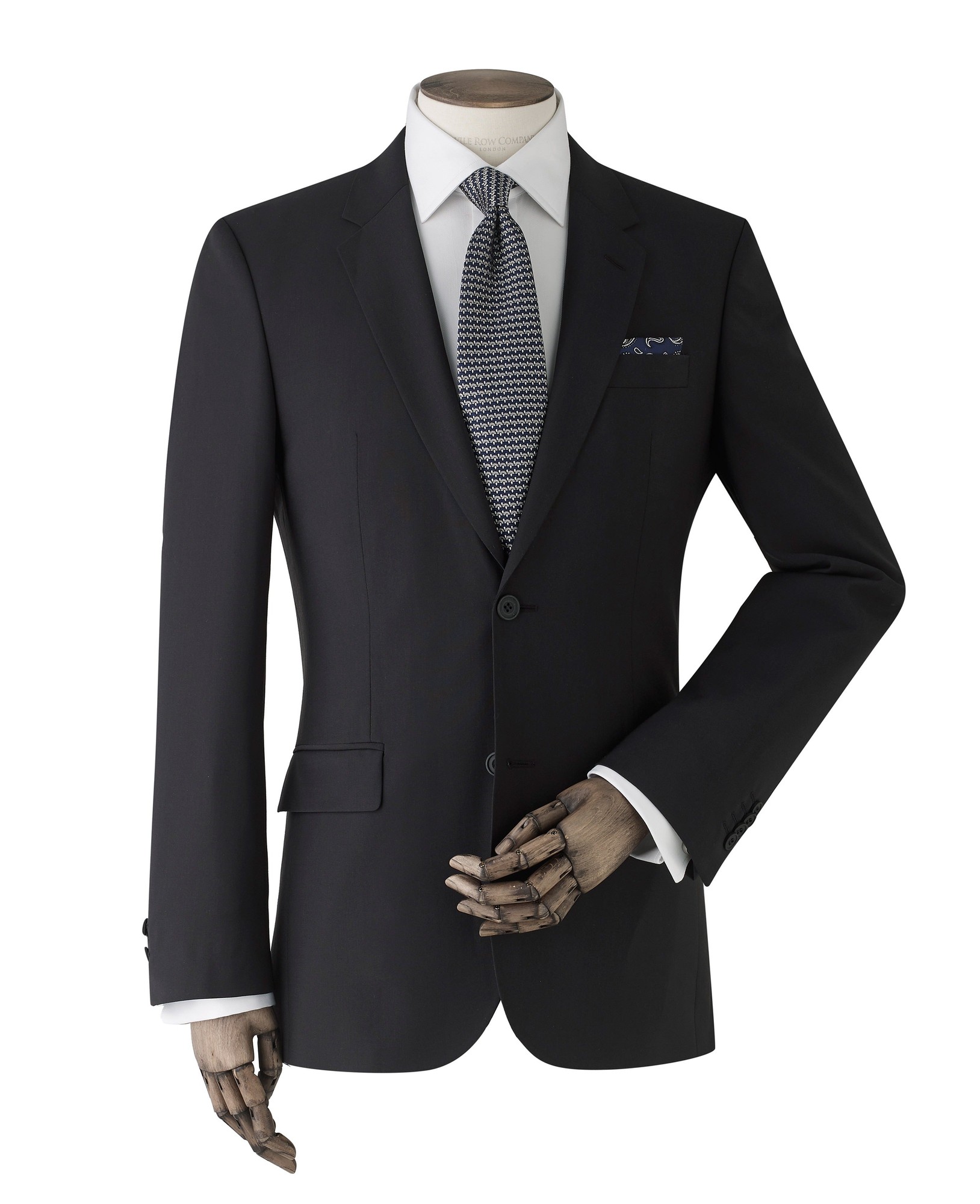 Men's black wool-blend suit jacket, size 38X short, featuring a tailored fit, single button closure, and a classic notch lapel, styled with a white shirt and patterned tie.